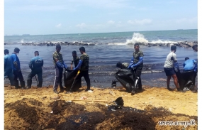 Troops rush to contain oil spill