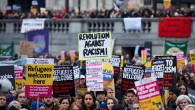 Thousands protest in European capitals to support migrants