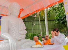 Floral tribute to Samadhi statue brought from Myanmar