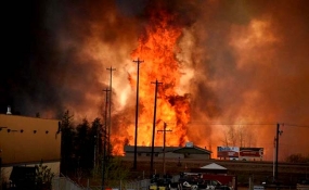 Canada’s fire ‘out of control,’ doubles in size