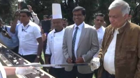 Prime Minister takes up the sword to cut a Potato cake