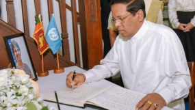 President signs condolence book on Ms. Una McCauley’s demise