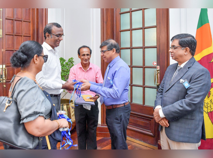First Flag for International White Cane Safety Day Presented to Secretary to the President