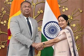 India aims to enhance and qualitatively improve ties with Sri Lanka