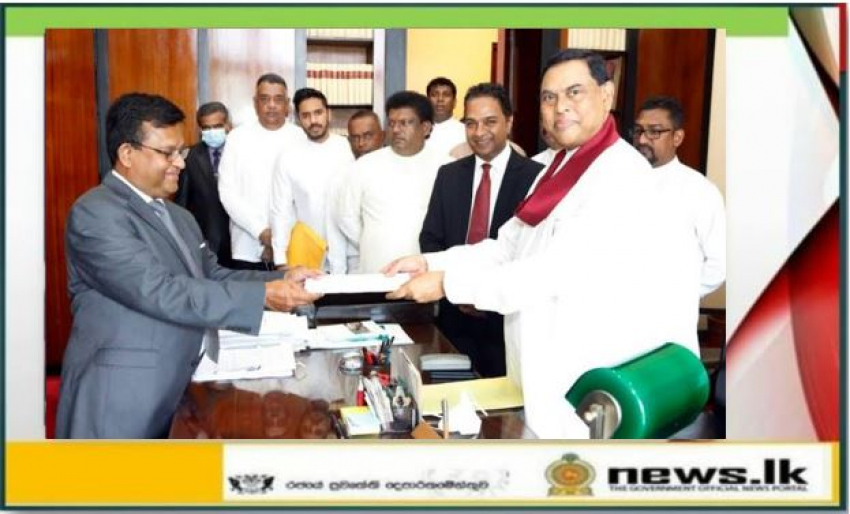 Member of Parliament Basil Rohana Rajapaksa hands over his resignation letter to the Secretary General of Parliament.