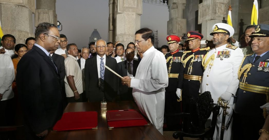Maithripala Sirisena sworn in as New President and Ranil  as Prime Minister