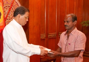 President distributes compensation payments to families of gem mine accident victims