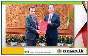 Dr. Palitha Kohona presents copy of the credentials to the DG of the Department of Protocol of the Ministry of Foreign Affairs of China