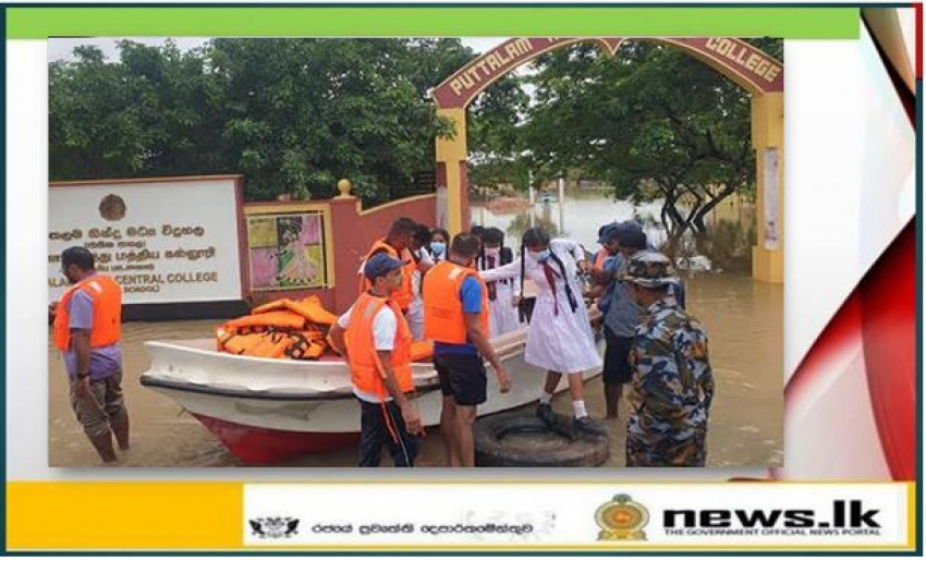 Navy relief teams render assistance to school children affected by flood