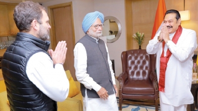 PM meets Manmohan, Rahul