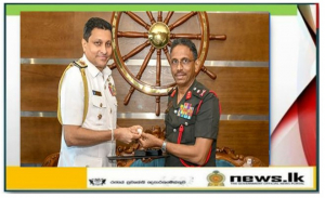 Newly-introduced NDC insignia presented to Commander of the Navy