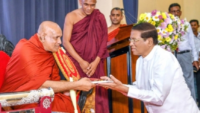 President presents Scroll to Anu Nayake Thero